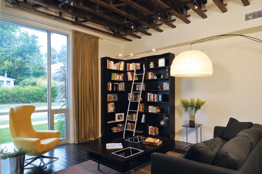 
Reclaimed barnwood floors and roof beams lend a rustic feel to the sleek home's modern design.
